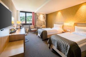 Modernes Doppelzimmer im Best Western Plus Central Hotel Leonhard Feldkirch mit zwei Betten